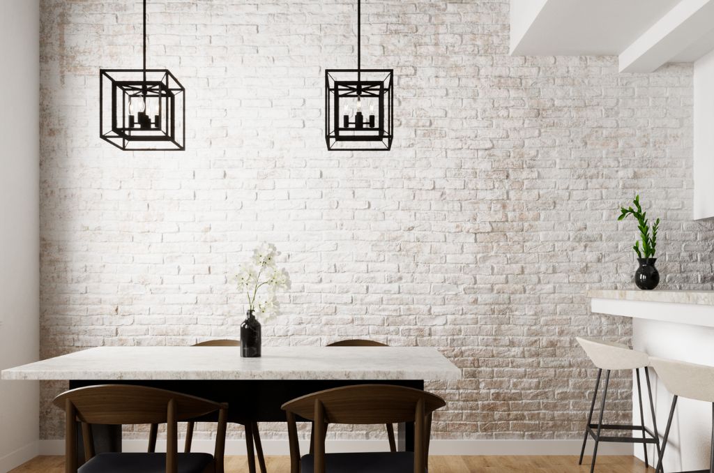 Doherty pendants in natural black iron finish over dining room table.