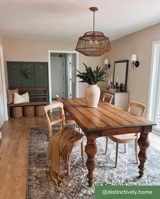 Brookhollow large pendant mounted over wood dining table.